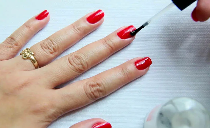 How can I make nail polish dry faster?