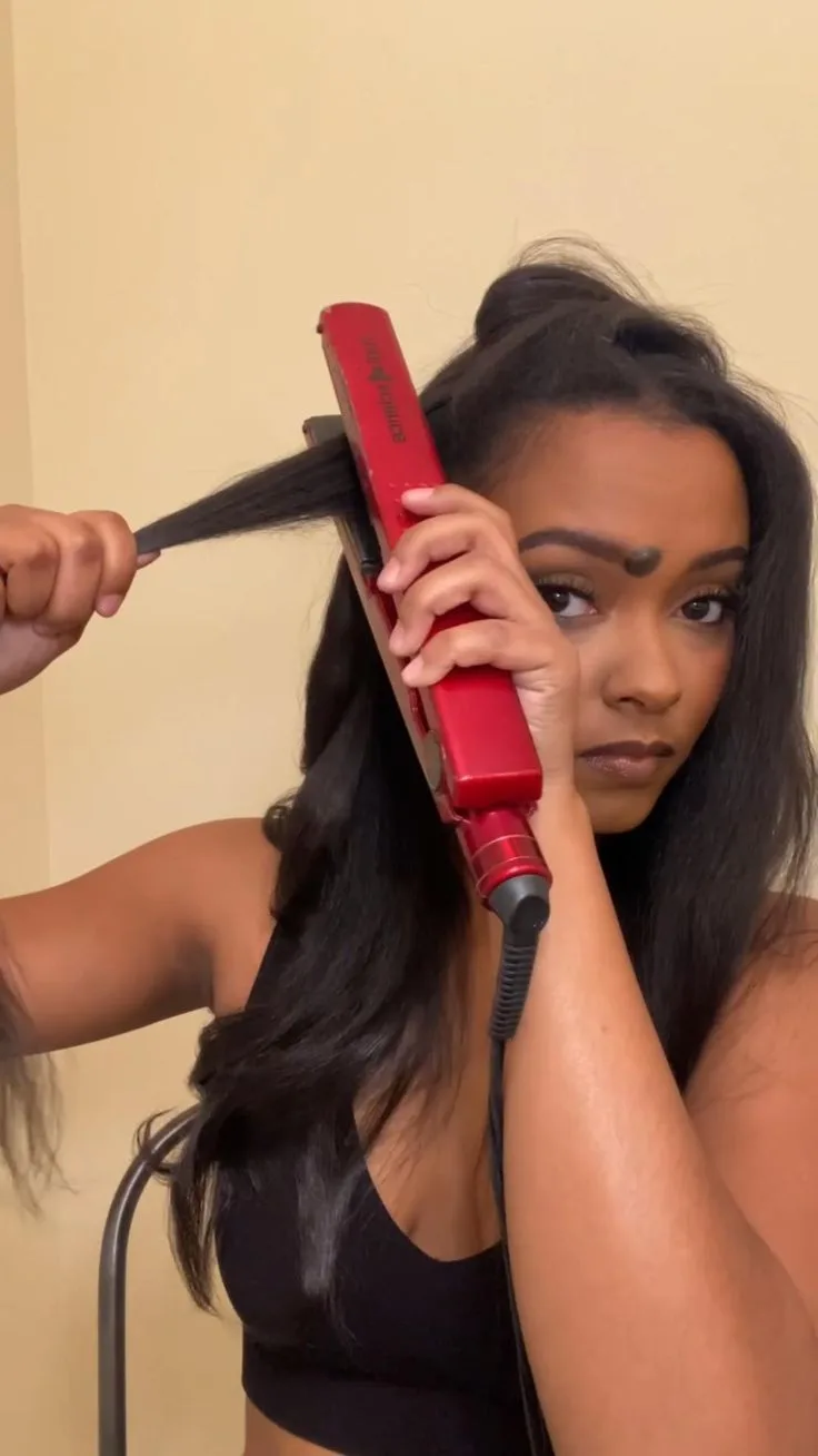 How do I curl my hair with a straightener?